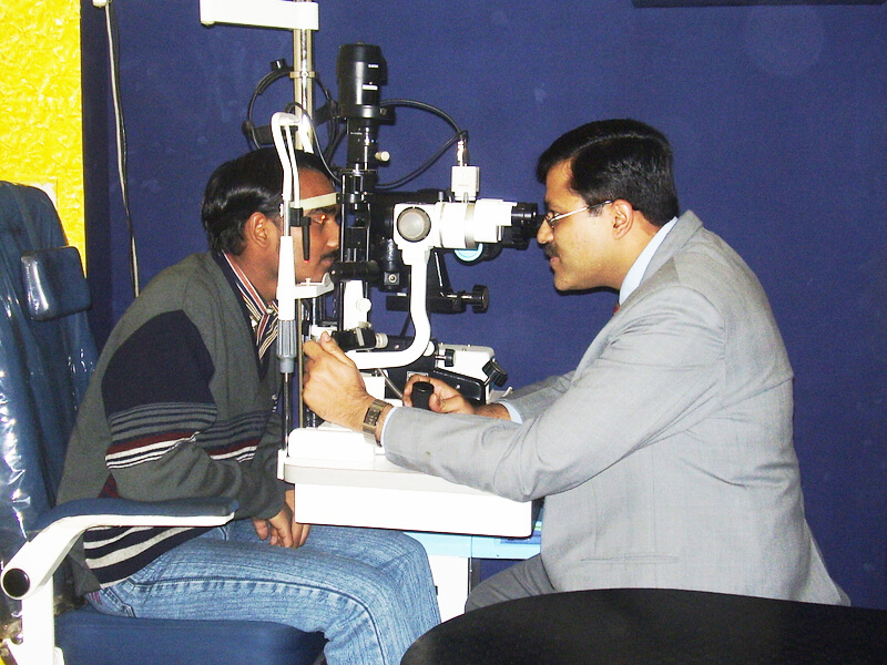 Dr Ashish Jain at slit lamp