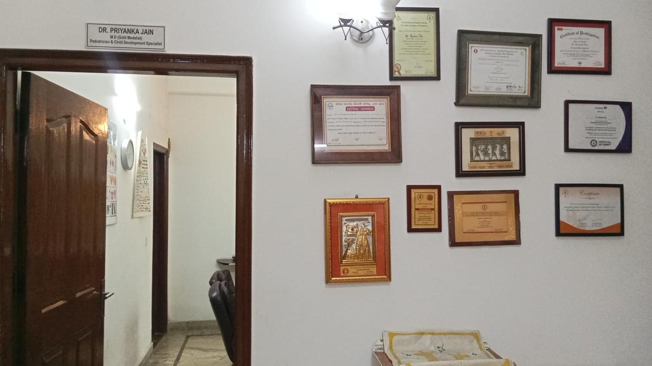 Wall of achievements and certificates inside Tulip Clinic