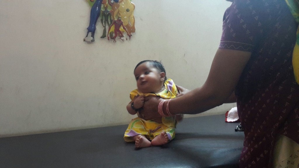 4 month old child with poor neck holding