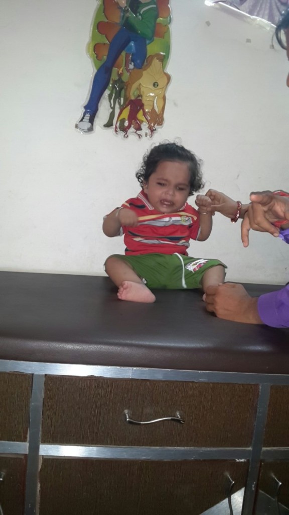 Child with poor neck holding and sitting